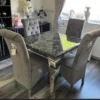 1m dining table and 4 velvet lion knocker chairs. Set in a kitchen.