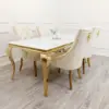 Louis gold leg dining table and cream bentley chairs